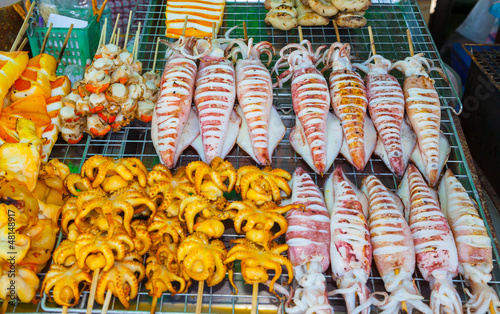 Many of grilled squid ready for sale in street market