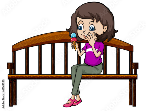 A smiling girl eating ice cream