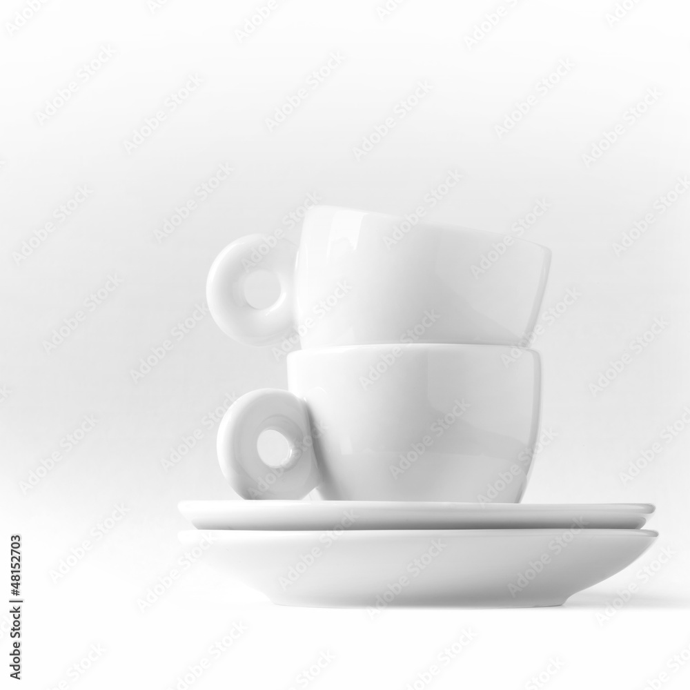 Double espresso metaphor with two small white cups Double espresso metaphor with two small white cups