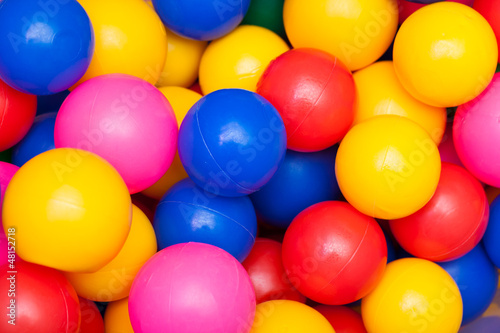 Colorful plastic balls. Bright abstract fun colors background