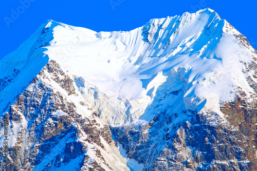 The snow-white glacier on a mountain peak