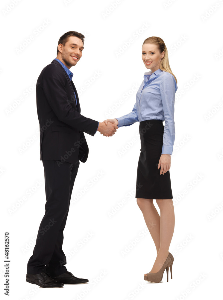 man and woman shaking their hands