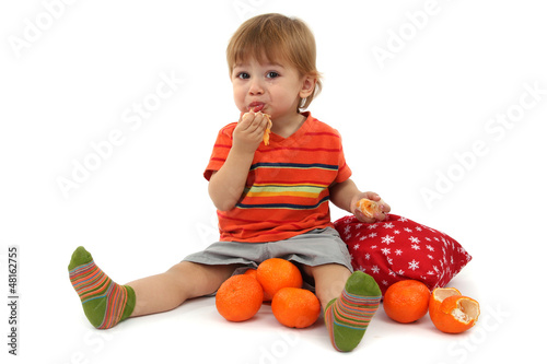 cute little boy eating tang...