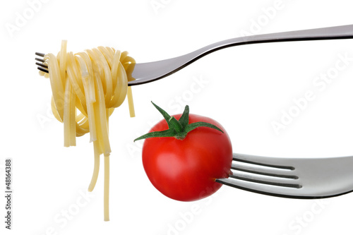 spaghetti and tomato on forks isolated