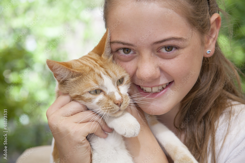 young girlh holding her ginger cat young girlh holding her ginger cat