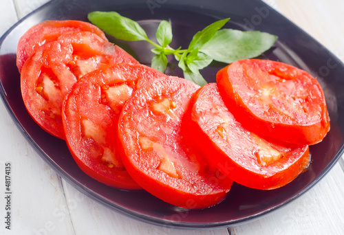 Fresh tomato with green aroma basil