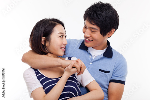 Happy young Asian couple isolated on white background.