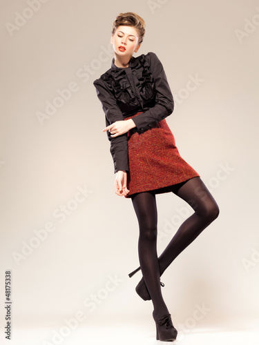 sexy woman dressed elegant doing a fashion shoot