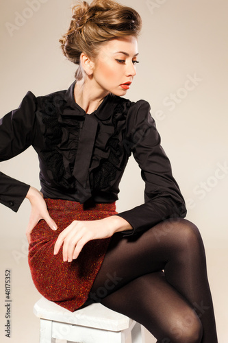 sexy woman dressed elegant doing a fashion shoot