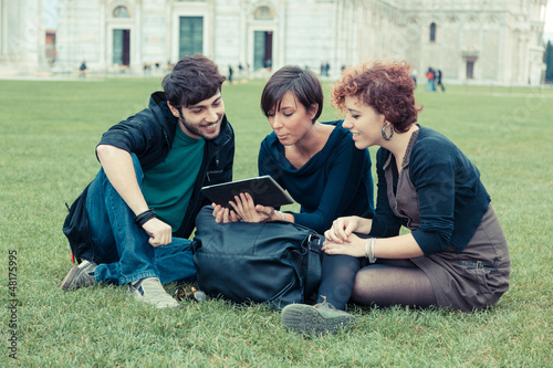 Group of Friends with Tablet PC Outside