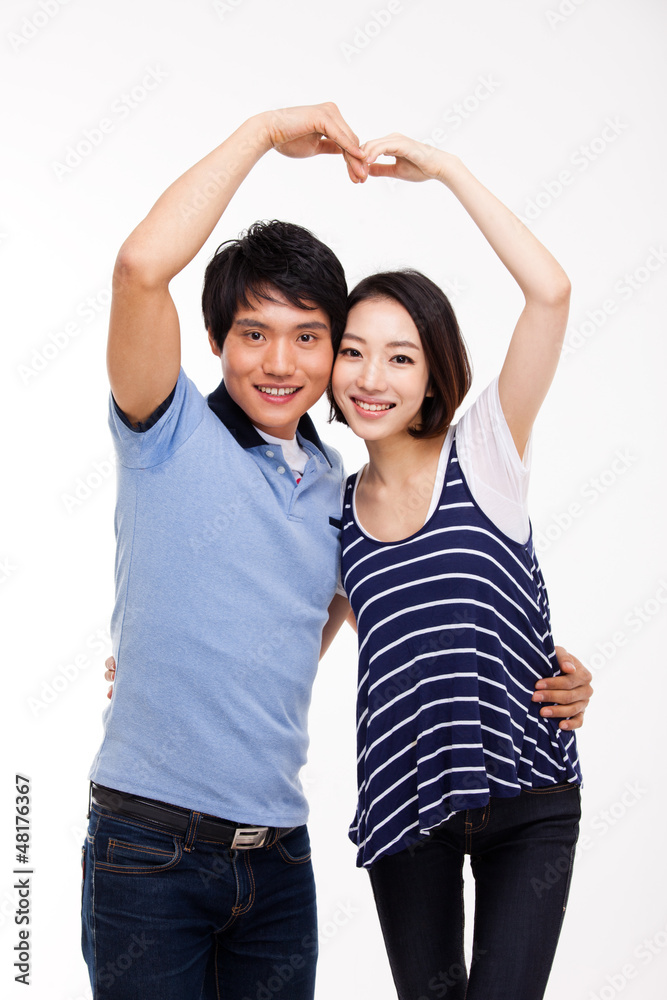 Young Asian couple make heart shape isolated on white background Young Asian couple make heart shape isolated on white background