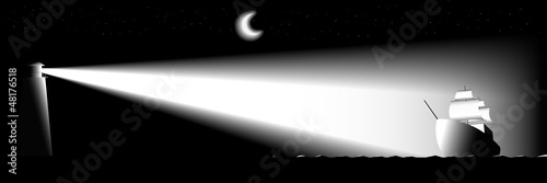 Lighthouse and sailing ship at night.