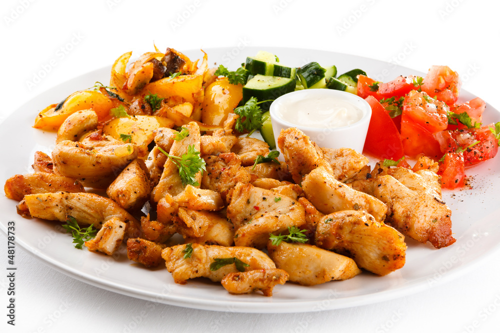 Grilled meat and vegetables on white background Grilled meat and vegetables on white background