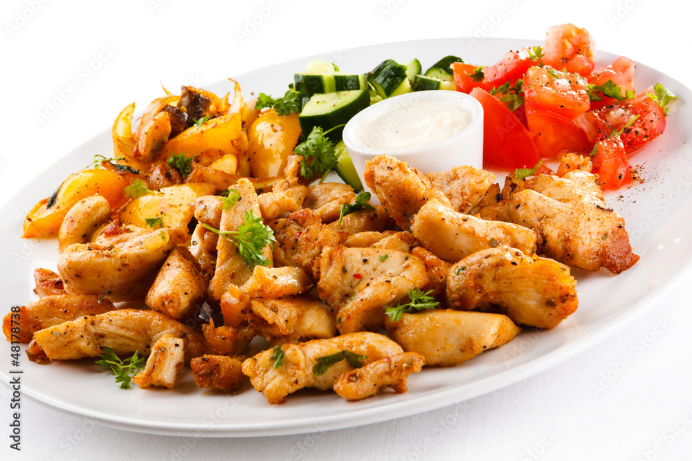 Grilled meat and vegetables on white background Grilled meat and vegetables on white background