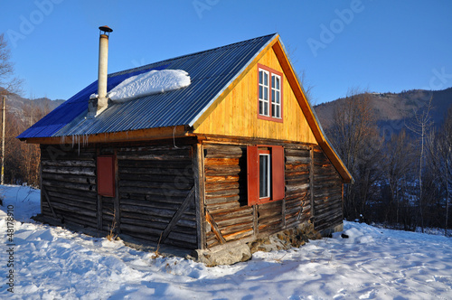 Small cabin in the mountains at winter © salajean