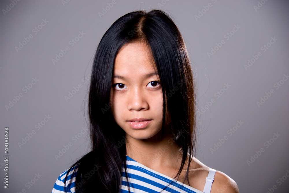Close-up portrait of brunette in a striped shirt Close-up portrait of brunette in a striped shirt