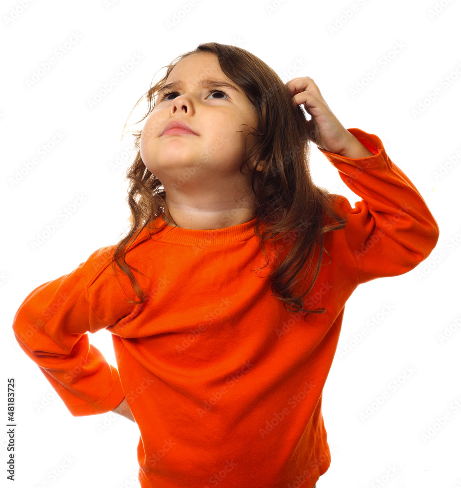 portrait brunette kid in orange sweater, scratching his head thi portrait brunette kid in orange sweater, scratching his head thi
