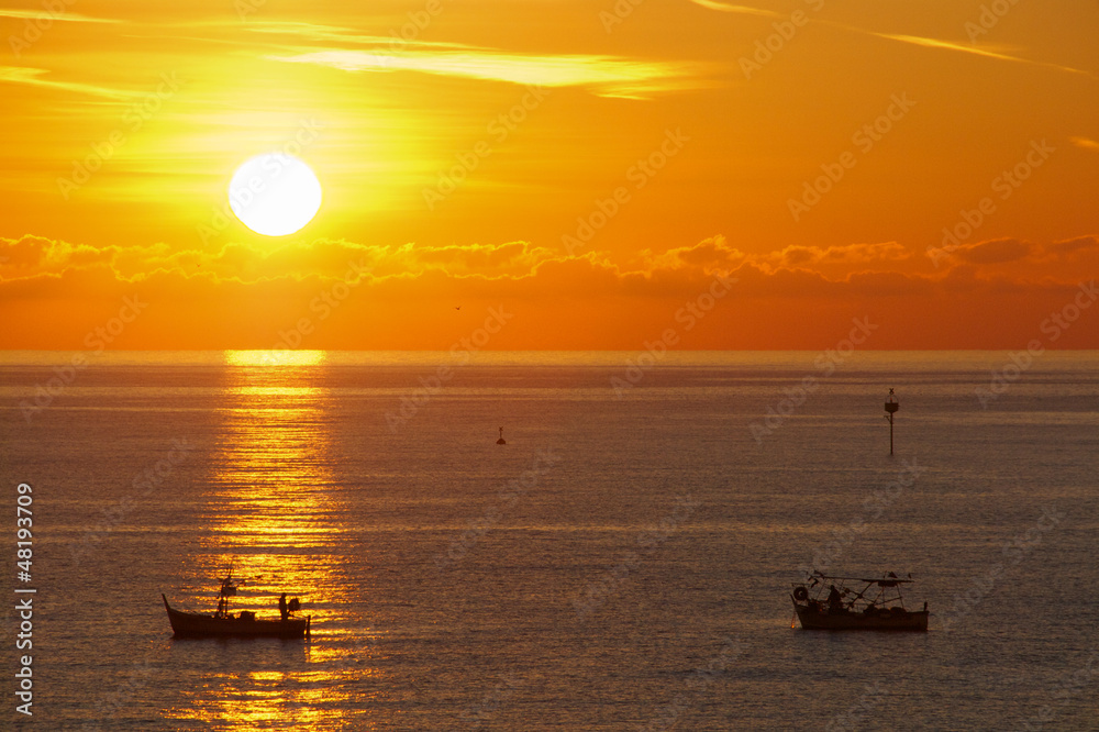 Sunset with two boats