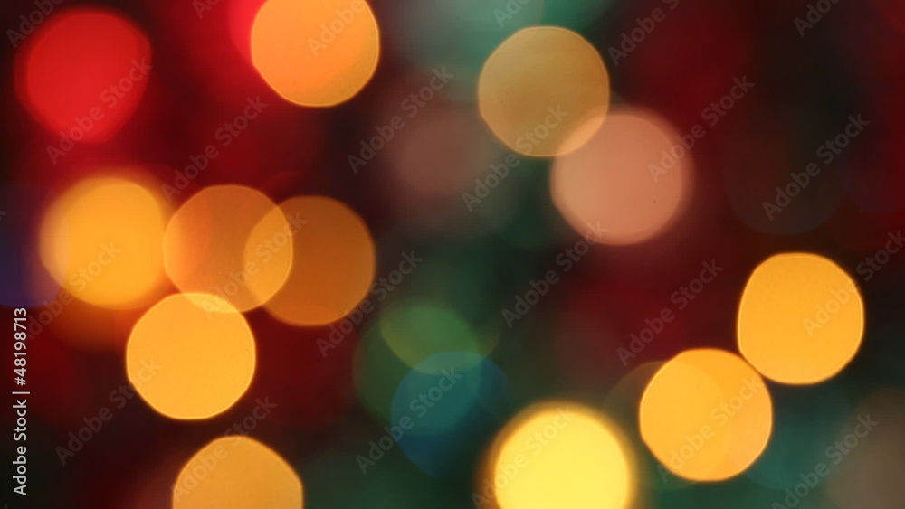 Out of focus colorful glimmering lights. Seamless loop.