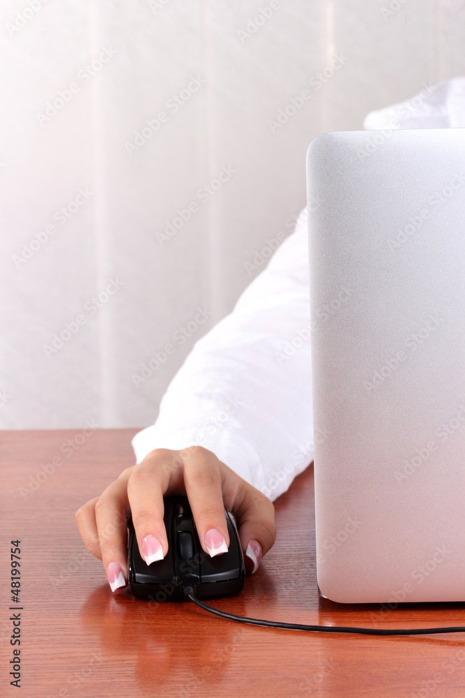 Fototapeta premium woman's hands pushing keys of pc mouse, close-up