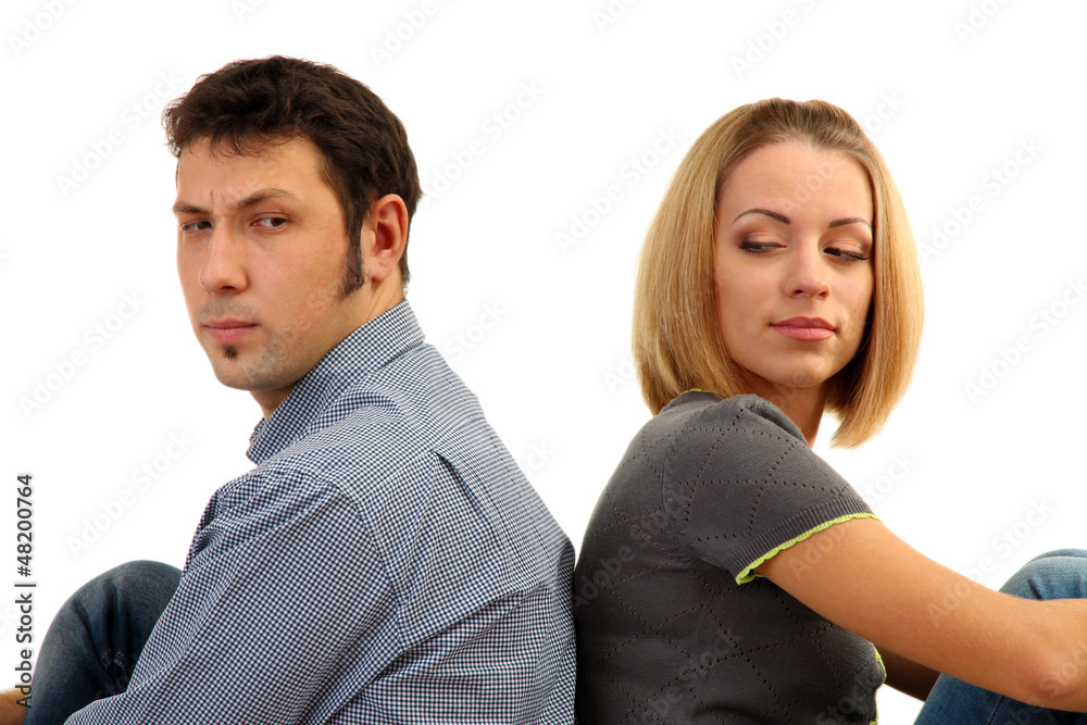 Young couple turning away from each other isolated on white Young couple turning away from each other isolated on white