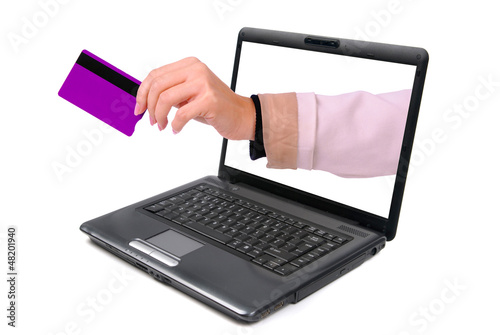 woman holding a credit card shopping online