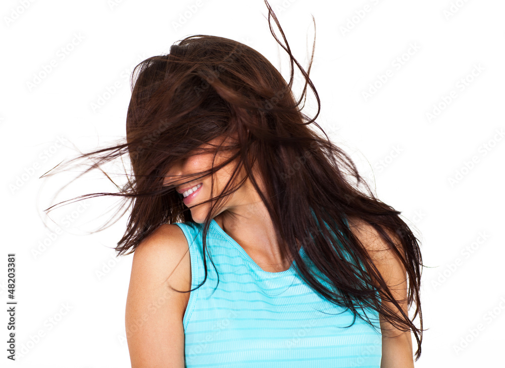 young woman having fun with messy hair isolated on white