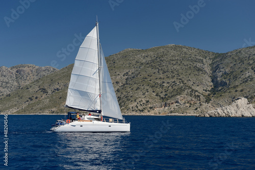 Sailing yacht around the beautiful island