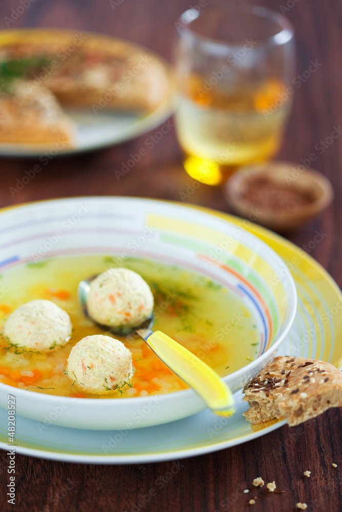 Soup with turkey meatballs, carrots and tselery, selective focus Soup with turkey meatballs, carrots and tselery, selective focus