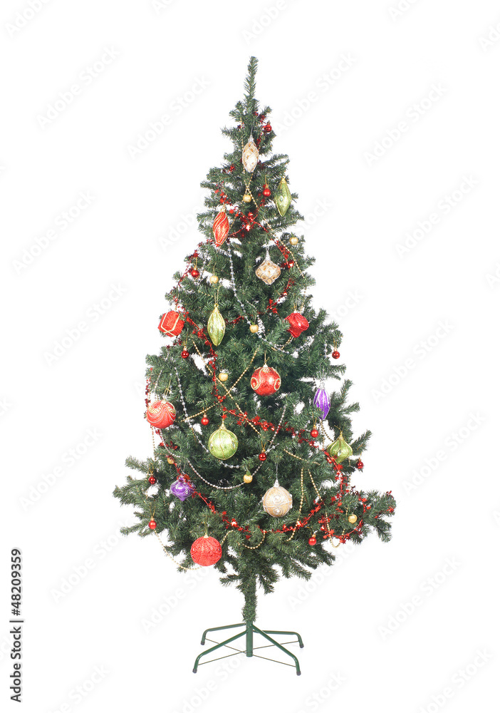 A beautiful green Christmas tree covered with toys and balls