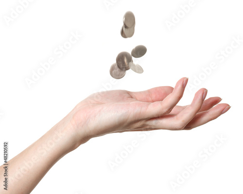 a male hand with falling coins