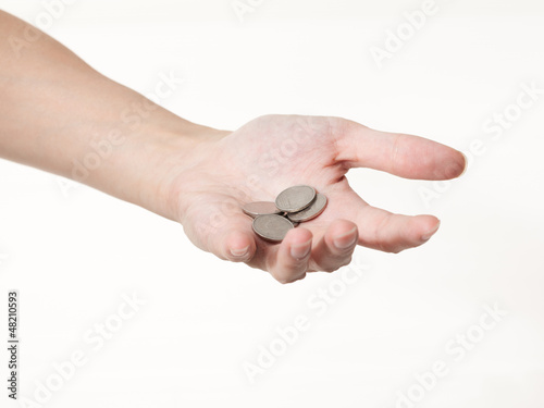 a male hand with coins