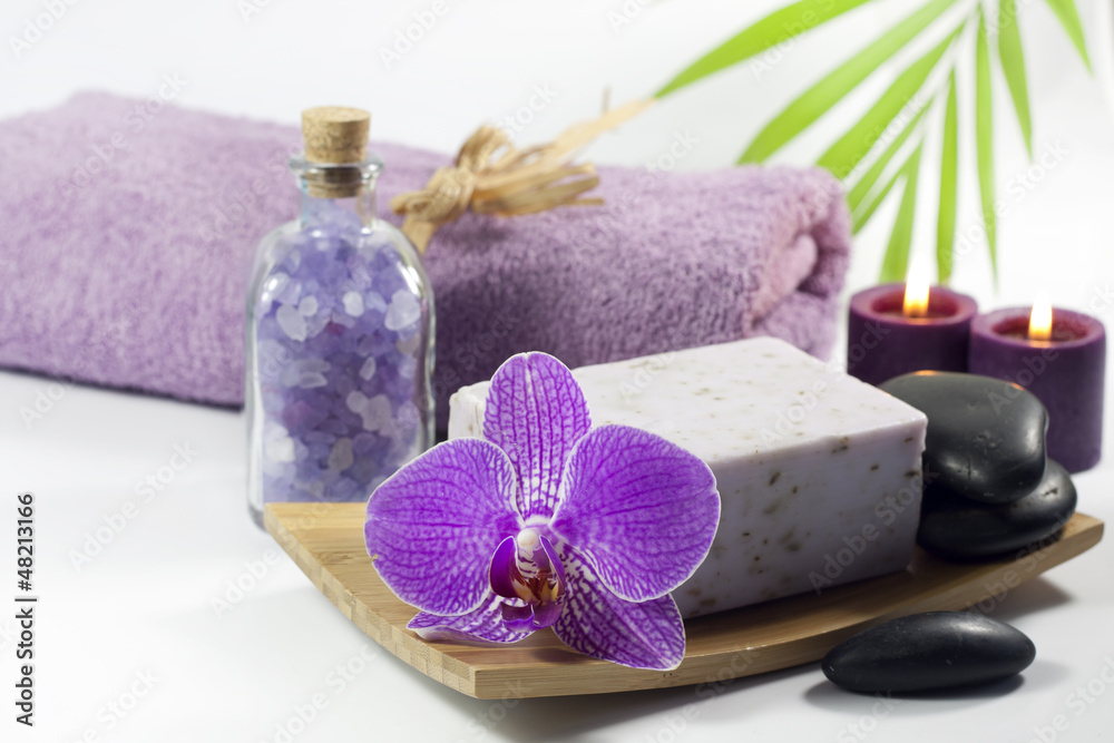 Spa soap with towel and orchids on white background Spa soap with towel and orchids on white background