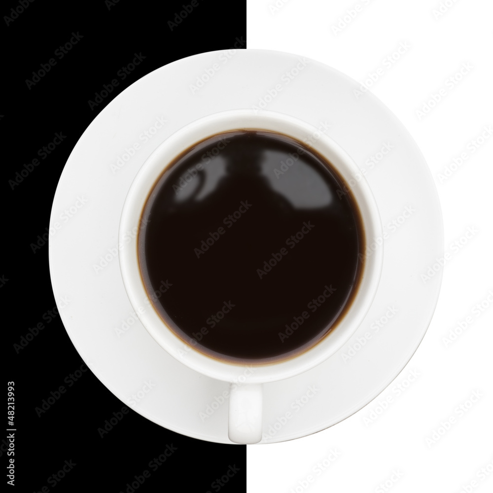 Highly stylised image of coffee cup and saucer on black and whit Highly stylised image of coffee cup and saucer on black and whit