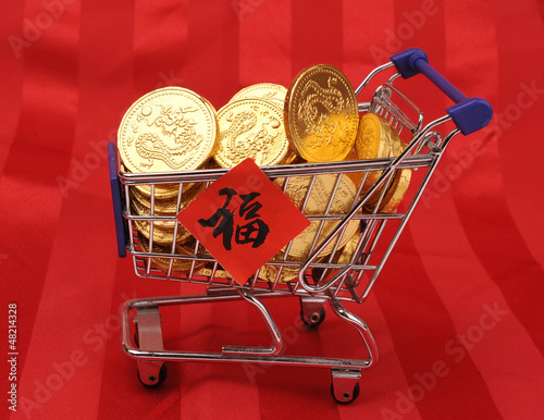 Gold coins in shopping cart,Chinese New Year Calligraphy for 