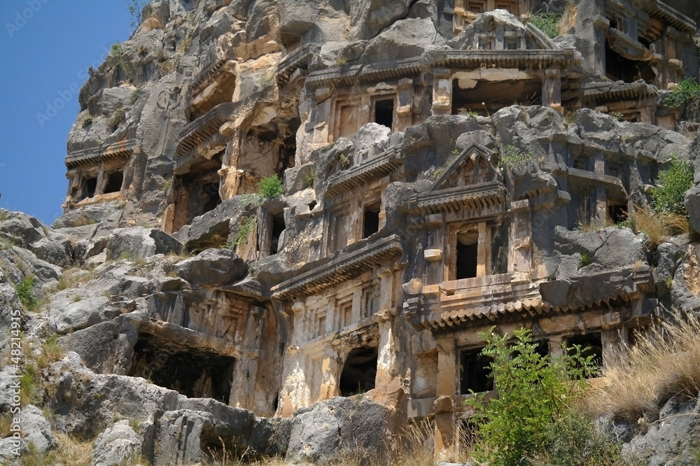 Historical tombs in the mountains near Myra town , Turkey . 
