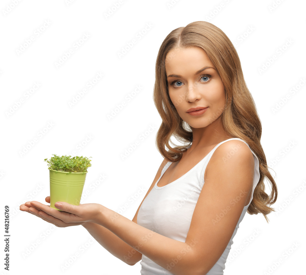 woman with green grass in pot