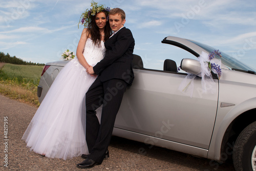 groom and bride on a background cabriolet © Aliaksandr Zabudzko