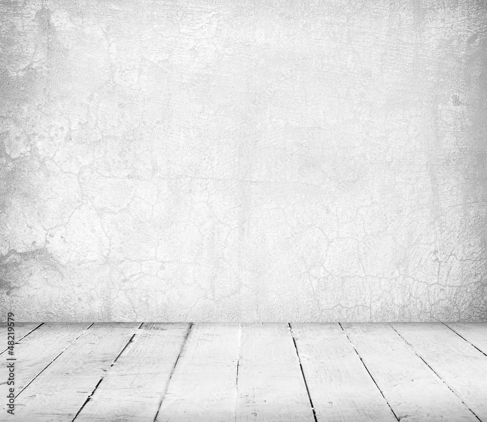 Fototapeta premium This empty room interior features a rough, stained white concrete wall and a worn white wooden plank floor, creating a grunge texture background.