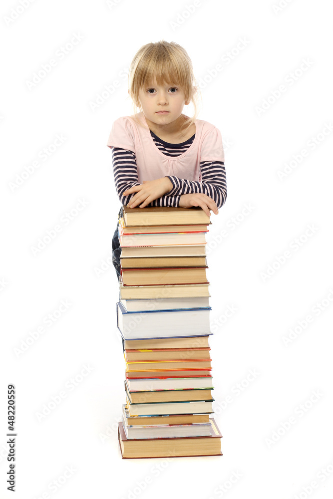 portrait of a beautiful little girl who holds out books portrait of a beautiful little girl who holds out books