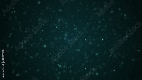 Small particles continuously move around the screen.