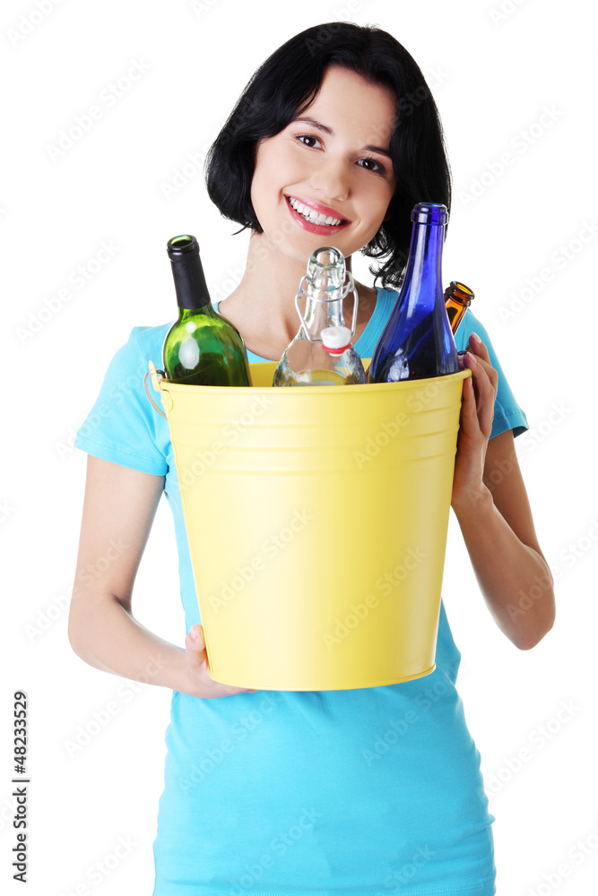 Beautiful young woman holding recycling bin Beautiful young woman holding recycling bin