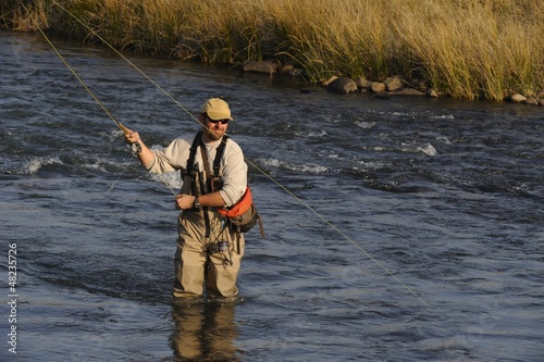 flyfishing for trout Umzimkulu river, Underberg, Natal. photo