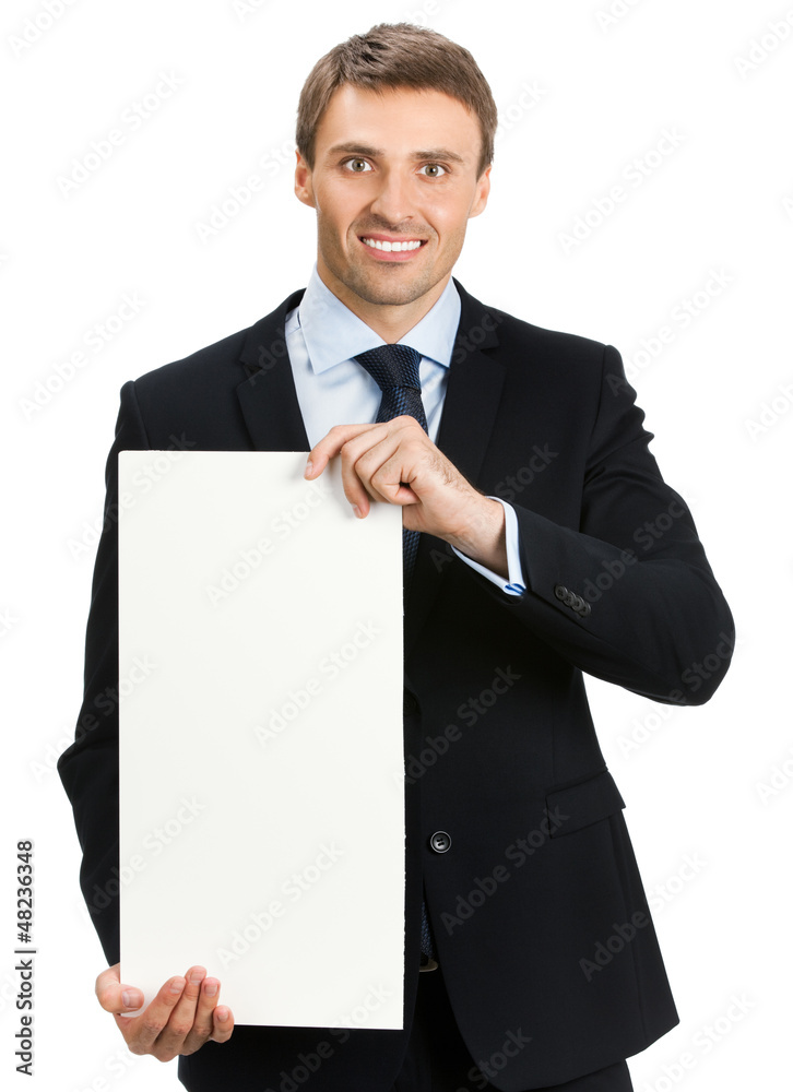 Happy businessman showing signboard, isolated Happy businessman showing signboard, isolated