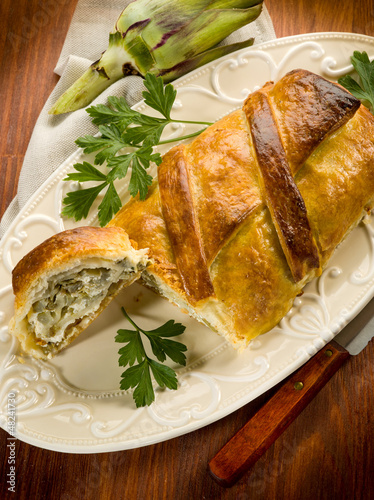 strudel with artichoke and ricotta, vegetarian food photo