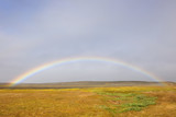 Rainbow over grasslands.