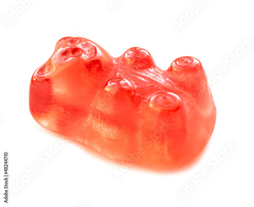 Red jelly bear on white background.
