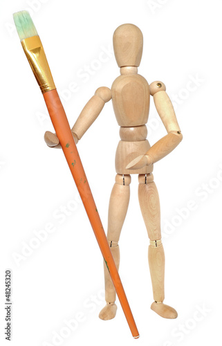 Wooden dummy with a paint brush