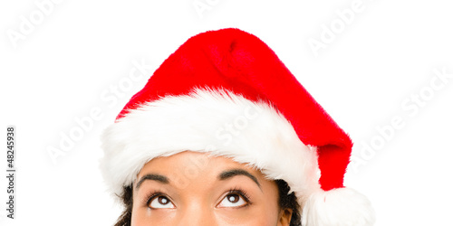 Close up of pretty African American girl wearing Christmas hat
