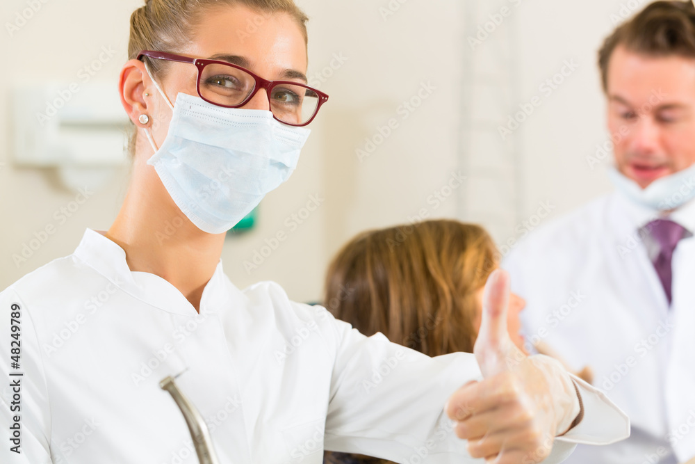 Dentist in her surgery Dentist in her surgery